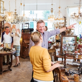 A couple explores an antique store searching for the perfect gift. | BRG