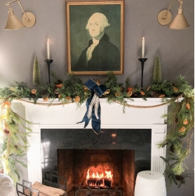 A portrait of George Washington surrounded by eclectic holiday design elements creates a historic holiday mantle-scape. | BRG