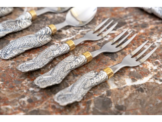 Partial Flatware Set With Cast Figural Handles
