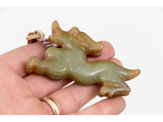 Playful Chinese Celadon And Russet Jade Kylin Form Toggle