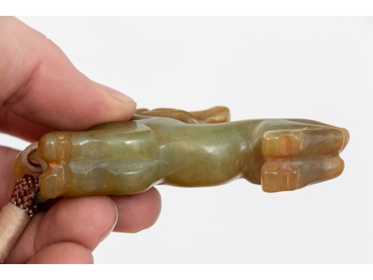 Playful Chinese Celadon And Russet Jade Kylin Form Toggle