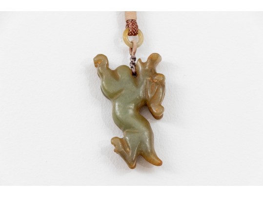 Playful Chinese Celadon And Russet Jade Kylin Form Toggle
