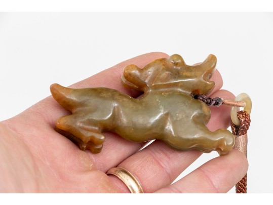 Playful Chinese Celadon And Russet Jade Kylin Form Toggle