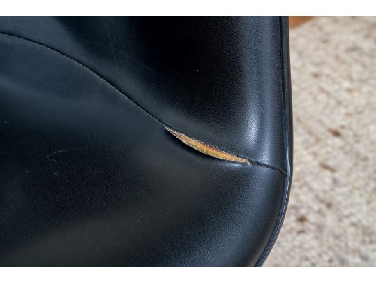 A Mid Century Modern Black Fiberglass Shell Chair