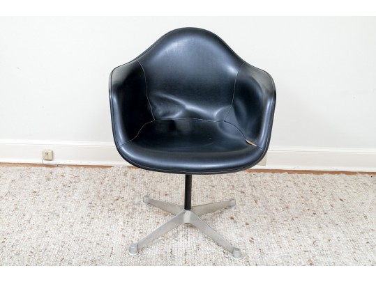 A Mid Century Modern Black Fiberglass Shell Chair