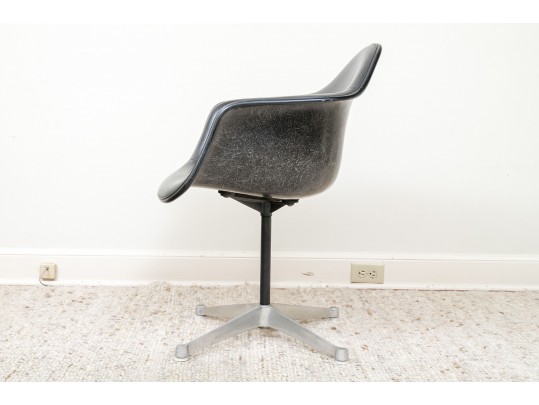 A Mid Century Modern Black Fiberglass Shell Chair