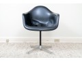 A Mid Century Modern Black Fiberglass Shell Chair