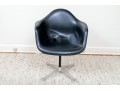 A Mid Century Modern Black Fiberglass Shell Chair