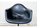 A Mid Century Modern Black Fiberglass Shell Chair