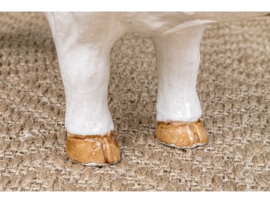 A Family Of Three French White Glazed Terracotta Pigs