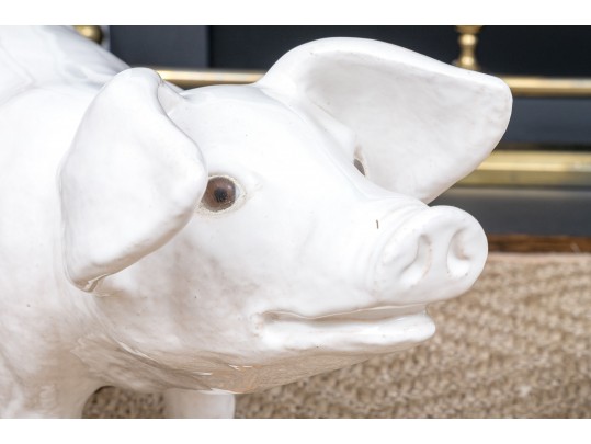 A Family Of Three French White Glazed Terracotta Pigs
