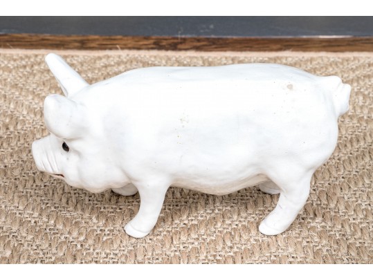 A Family Of Three French White Glazed Terracotta Pigs