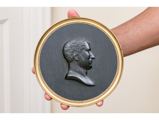 A Carved Ebony Wall Plaque Of Young Napoleon