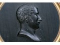 A Carved Ebony Wall Plaque Of Young Napoleon