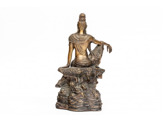 A 20th Century Asian Bronze Figure Of A Reclining Female Deity On A Rock