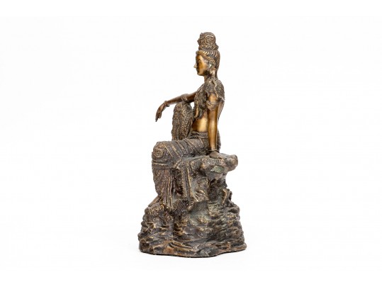 A 20th Century Asian Bronze Figure Of A Reclining Female Deity On A Rock