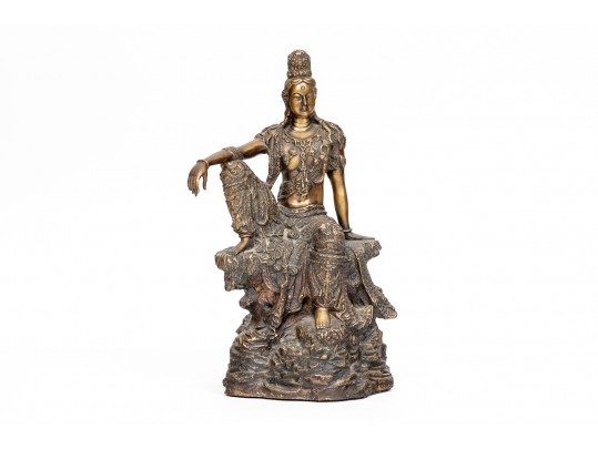 A 20th Century Asian Bronze Figure Of A Reclining Female Deity On A Rock