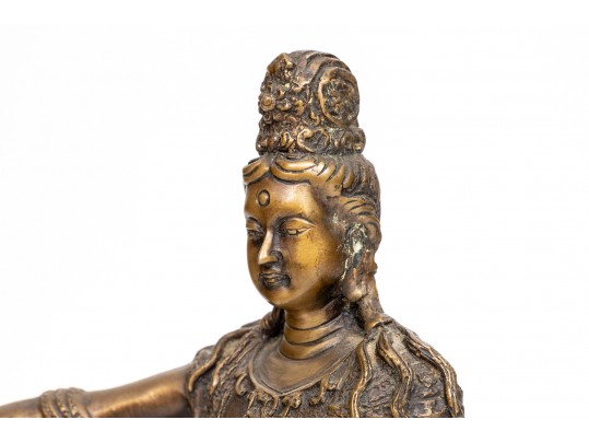 A 20th Century Asian Bronze Figure Of A Reclining Female Deity On A Rock