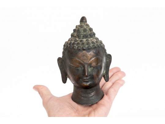 An Antique Small Bronze Dark Patinated Head Of Buddha, With Headdress