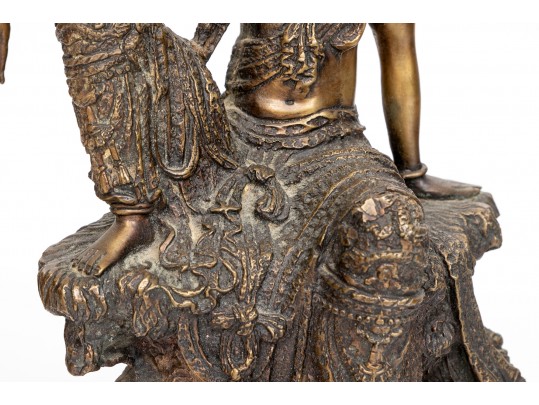 A 20th Century Asian Bronze Figure Of A Reclining Female Deity On A Rock