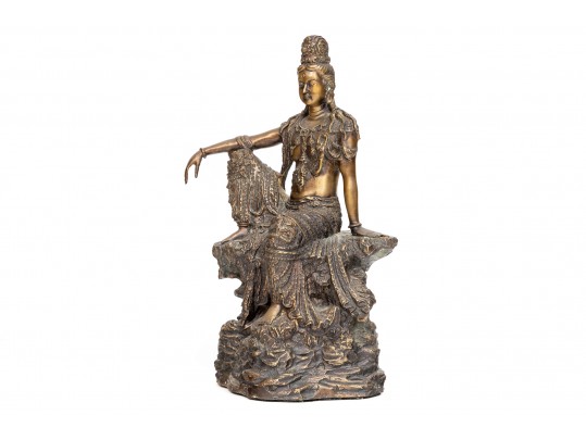 A 20th Century Asian Bronze Figure Of A Reclining Female Deity On A Rock