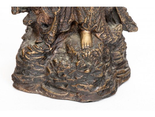 A 20th Century Asian Bronze Figure Of A Reclining Female Deity On A Rock