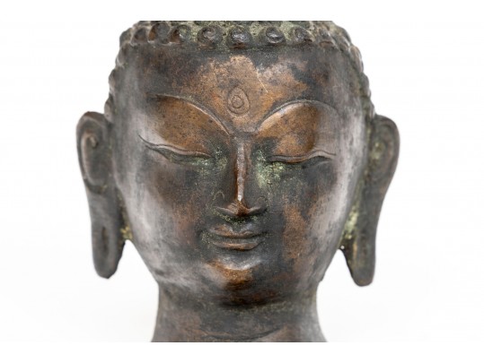 An Antique Small Bronze Dark Patinated Head Of Buddha, With Headdress