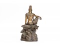 A 20th Century Asian Bronze Figure Of A Reclining Female Deity On A Rock