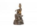 A 20th Century Asian Bronze Figure Of A Reclining Female Deity On A Rock