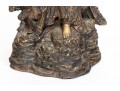 A 20th Century Asian Bronze Figure Of A Reclining Female Deity On A Rock