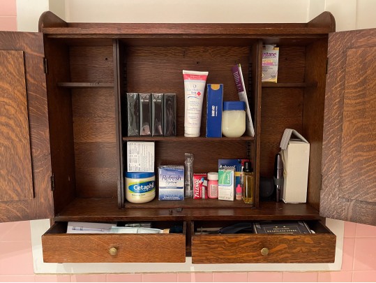 A Late 19th Century American Dark Patinated Oak Wall Mounted Medicine Cabinet