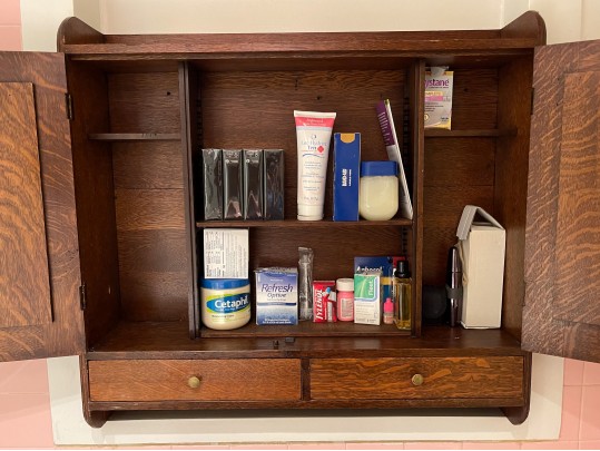 A Late 19th Century American Dark Patinated Oak Wall Mounted Medicine Cabinet
