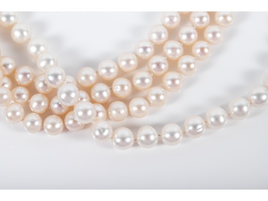 Four Similar Knotted Large Cultured Pearl Necklaces With 14k Yellow Gold Claps