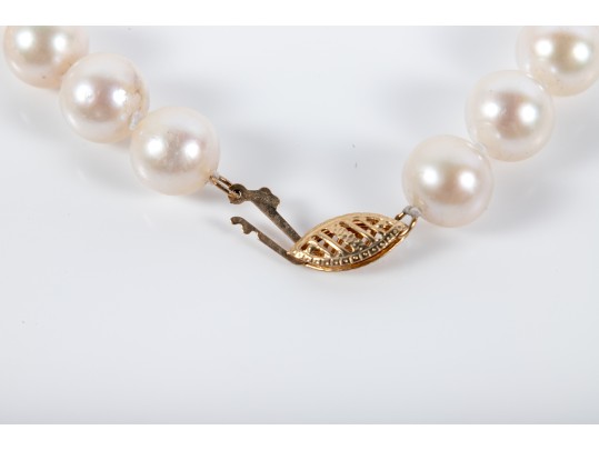 Four Similar Knotted Large Cultured Pearl Necklaces With 14k Yellow Gold Claps