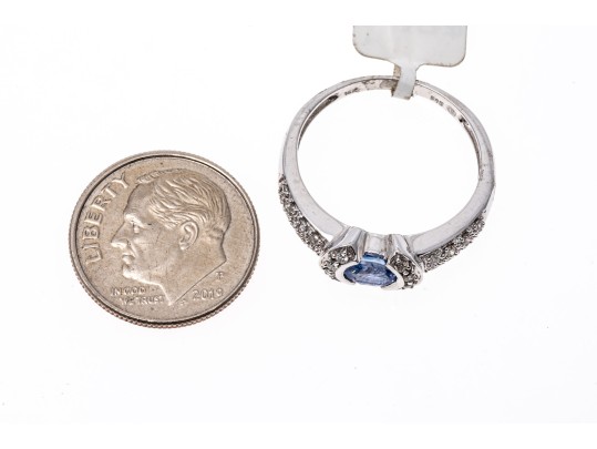 14k White Gold Contemporary Pale Blue Sapphire And Pave Set Diamond Ring, 0.19 TCW, Size 7