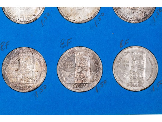 Collection Of 24 Canadian Silver Dollars