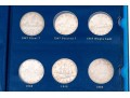 Collection Of 29 Canadian Silver Dollars