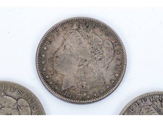 Four Morgan Silver Dollars