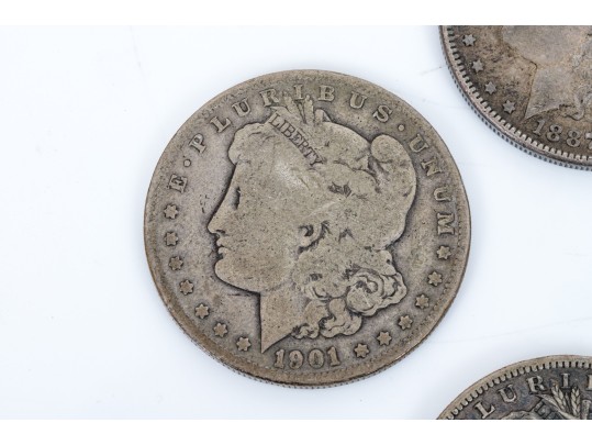 Four Morgan Silver Dollars