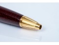 Cartier Iconic Ribbed Marbled Burgundy Composite And Gold Tone Ballpoint Pen