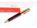 Cartier Iconic Ribbed Marbled Burgundy Composite And Gold Tone Ballpoint Pen