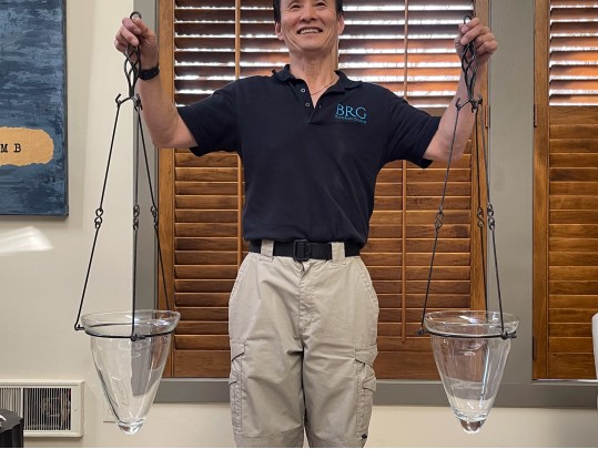 A Pair Of Decorative Glass Hanging Vases