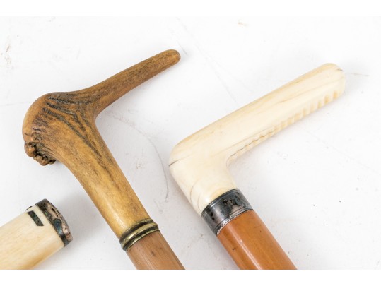 Lot Of Five Assorted Canes, Assorted Woods, Including A Hand Motif