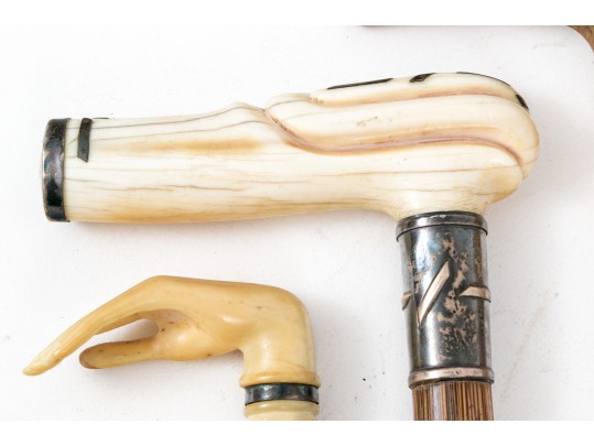 Lot Of Five Assorted Canes, Assorted Woods, Including A Hand Motif