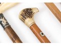 Lot Of Five Assorted Canes, Assorted Woods, Including A Hand Motif