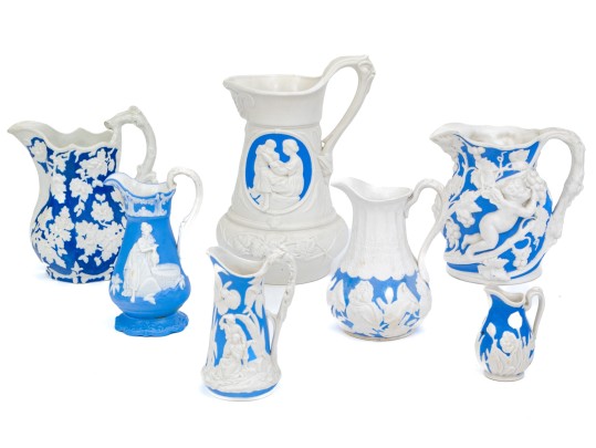 Set Of 7 High Relief Blue And White Creamers And Water Pitchers, One 'Sam Alcock And Co'