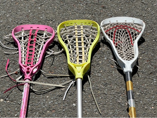 Three Lacrosse Girls Lacrosse Sticks