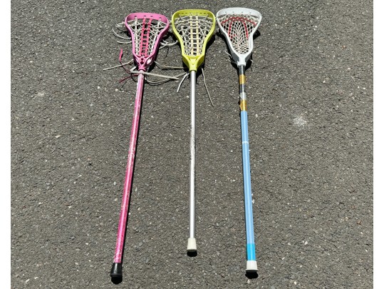Three Lacrosse Girls Lacrosse Sticks