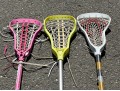Three Lacrosse Girls Lacrosse Sticks