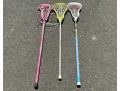 Three Lacrosse Girls Lacrosse Sticks